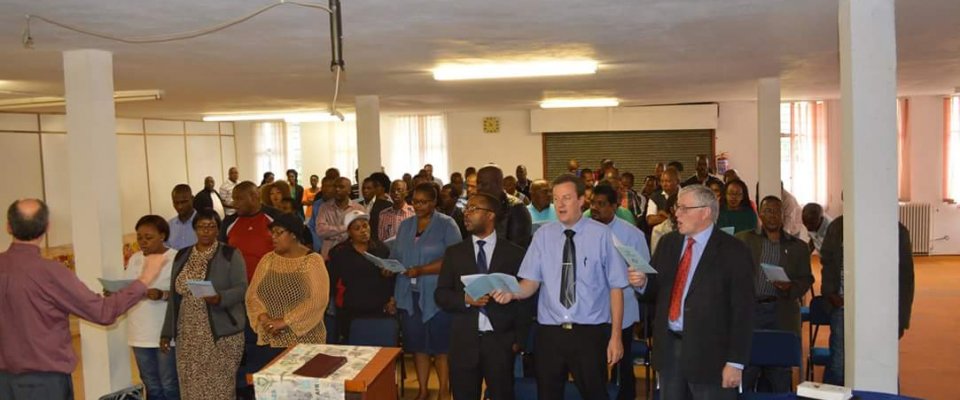 Students, Staff and Faculty singing during chapel service